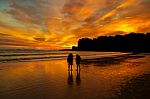 Sunset Couple On The Beach Stock Photo
