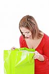 Surprised Brunette Woman Holding Opened Shopping Bag Stock Photo