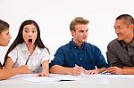 Surprised Businesswoman With Her Colleagues Workplace Stock Photo