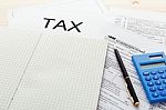 Tax Form With Blank Notebook Stock Photo