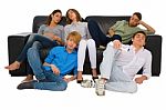 Teenagers Sleeping On Sofa Stock Photo