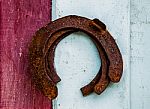The Old Rusty Horseshoe On Wood Background