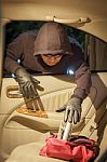 Thief Stealing Handbag From Car Stock Photo