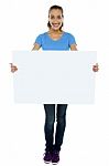 Trendy Woman Displaying Blank Billboard Stock Photo