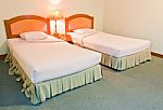 Twin Bed With Lamp Stock Photo