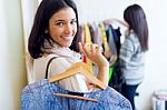 Two Beautiful Girls Shopping In A Clothes Shop Stock Photo