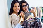 Two Beautiful Girls Shopping In A Clothes Shop Stock Photo