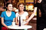 Two Beautiful Young Girls At Coffee Shop Stock Photo