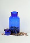 USA Coins In Blue Jar Stock Photo