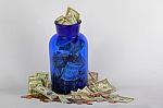 USA Money In Blue Jar Stock Photo