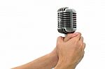 Vintage Microphone With Hands Isolated Stock Photo