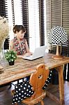 Vintage Polka Dot Lamp With Intentionally Blurred Working Woman Stock Photo