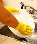 Washing Plates As Part Of The House Work Stock Photo