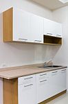 White And Wood Kitchen Cabinet Stock Photo