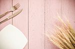 White Plate, Vintage Fork And Knife  On Rustic Pink Wooden Stock Photo