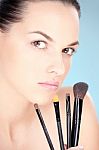 Woman And Cosmetic Brush Stock Photo