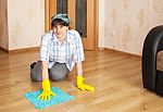 Woman Cleaning The Floor With A Rag Stock Photo