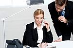 Woman Discussing Problem With Male Colleague Stock Photo