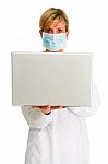 Woman Doctor With Laptop Stock Photo
