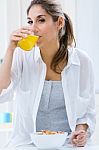 Woman Eating Cereals In The Morning Stock Photo