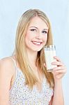 Woman Holding Glass Of Milk Stock Photo