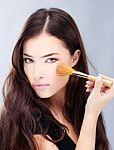 Woman Holding Powder Brush Stock Photo