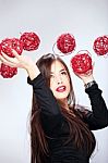 Woman Holding Red Balls Stock Photo