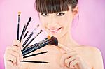 Woman Holding Set Of Make Up Brushes Stock Photo
