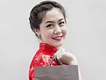 Woman In Cheongsam With Shopping  Stock Photo