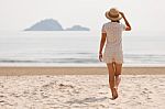 Woman In Hat On Beach Stock Photo
