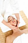 Woman In Spa Gets A Facial Massage Stock Photo
