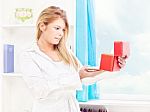 Woman Opening Fancy Box At Home Stock Photo