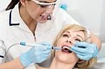 Woman Under A Dental Treatment Stock Photo