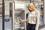 Woman Using Bank ATM Stock Photo