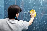 Woman Washes Tile With A Cloth Stock Photo