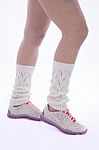 Woman's Legs With Leg Warmer And Tennis Shoes Stock Photo