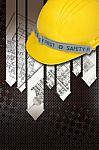 Yellow Hard Hat With Blueprints Stock Photo