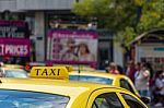 Yellow Taxi Sign On Cab Vehicle Roof Stock Photo