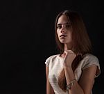 Young Beautiful Girl On A Black Background Stock Photo