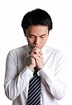 Young Business Man Praying Stock Photo