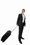 Young Business Man Walking On White Background With His Trolley Stock Photo