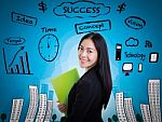 Young Business Woman Has Many Ideas On Business Background Stock Photo