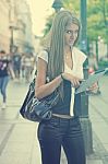 Young Business Woman With Tablet Computer Walking On Urban Stree Stock Photo