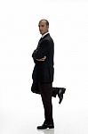 Young Businessman Standing On One Leg Stock Photo
