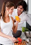 Young Couple In Kitchen Stock Photo