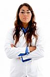 Young Female Doctor With Folded Hands Stock Photo