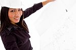 Young Female Engineer Searching Opened Blue Prints Stock Photo
