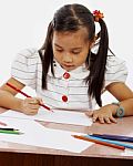 Young Girl Drawing Picture Stock Photo
