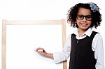 Young Girl Holding Black Marker Pen, Ready To Write Stock Photo