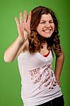 Young Girl Showing Four Fingers Stock Photo